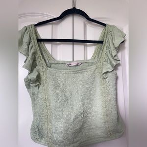 green frilly top